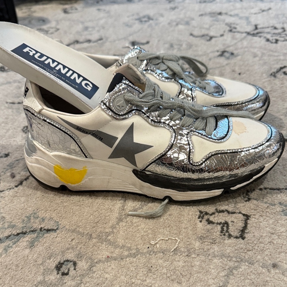Authentic Golden Goose running sneakers. They are labeled a size 36.
